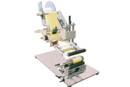 Etiqueteuse semi automatique pour produits cylindriques